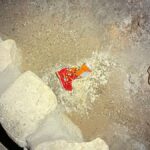 This photo provided by Carlsbad Caverns National Park shows a bag of Cheetos that was dropped off trail by a visitor in the Big Room at the national park near Carlsbad, N.M.