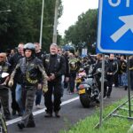 Members of the Satudarah (One Blood) motorcycle gang leave after Dutch riot police blocked a group of 150 riders on the A2 motorway at the entrance to Amsterdam, Netherlands.