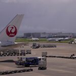 Japan Airlines airplanes are parked at a terminal at the Haneda international airport in Tokyo.