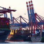 Container freighters are moored in the port of Waltershof in Hamburg