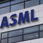 FILE - the logo of ASML, a leading maker of semiconductor production equipment, hangs on the head office in Veldhoven, Netherlands, Monday, Jan. 30, 2023.