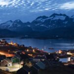 FILE PHOTO: Homes are illuminated after the sunset in Tasiilaq, Greenland, Friday Aug. 16, 2019.